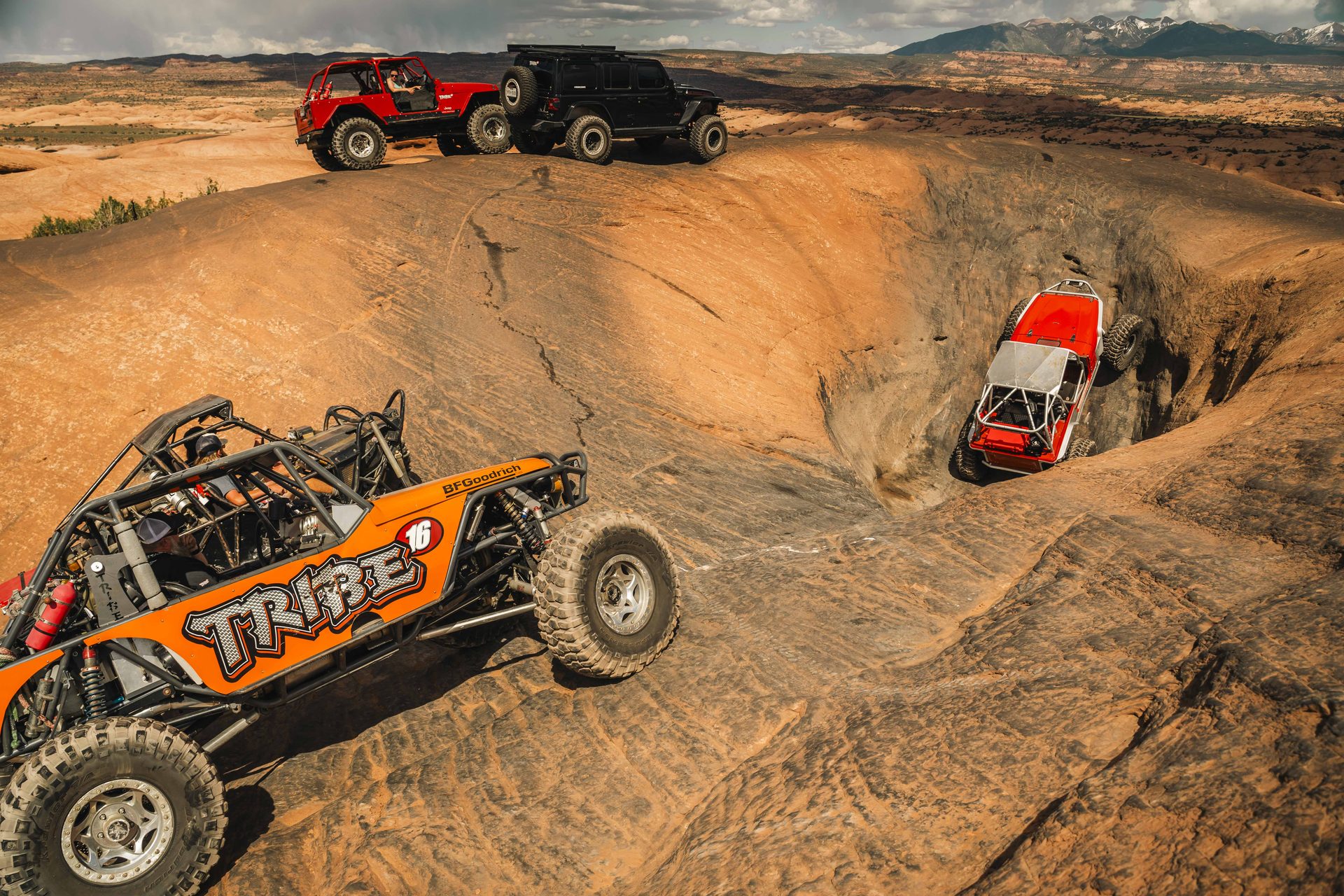 Tribe 16 rock buggy crawling out of a slickrock bowl